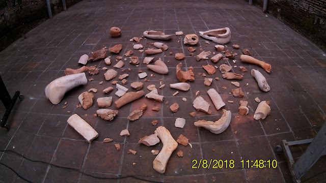 Fragments of a broken human clay statue