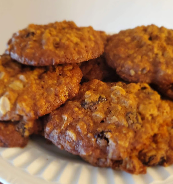 oatmeal raisin cookies stacked on a serving plate