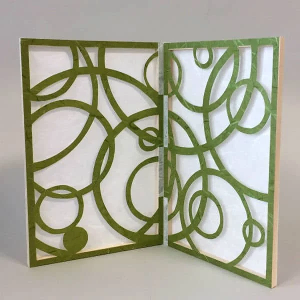 paper stencil screen with cut swirls design