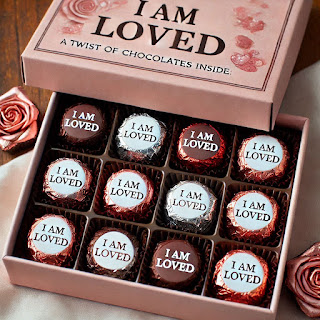 Valentine’s chocolates, with affirmation “I am loved,” written on the wrappers.