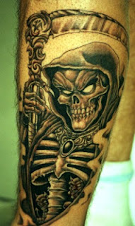 grim reaper / skeleton tattoo on the arm