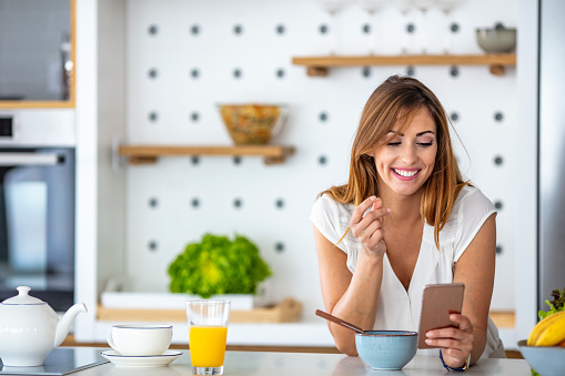 Beauty Woman Eat Healthy Foods for Breakfast