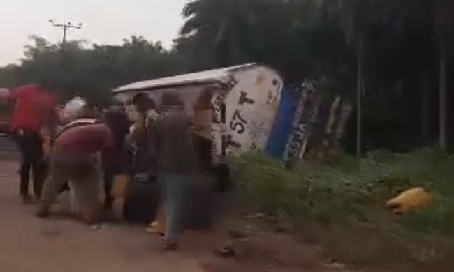 Residents scoop fuel from a fallen tanker in Cross River State