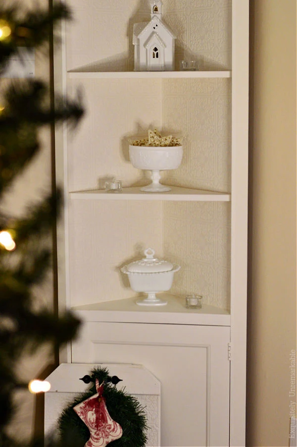 Thrift Store Christmas Decor on a corner hutch