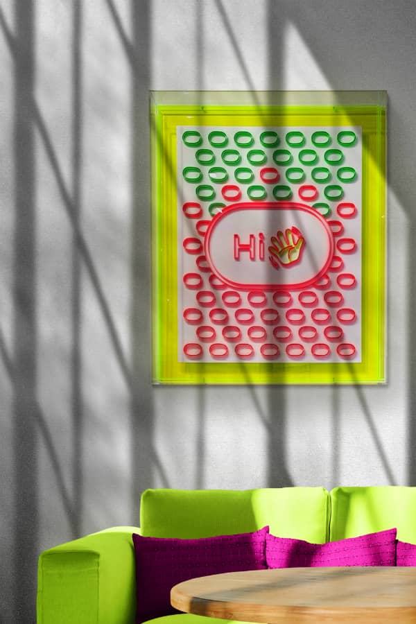 framed on-edge, fluorescent paper art composed of rounded corner rectangles, and a centered hand waving alongside word Hi