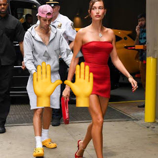 Justin Bieber Instagram post showing Hailey's Vogue cover with mysterious 🙌 emoji caption