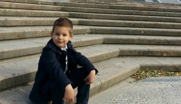 Dionis Senjo sitting on the stairs of the former dictator Pyramid