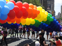 A rainbow arc of balloons