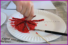 dipping firework craft into the paint