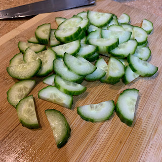 Chopped cucumbers on cutting board