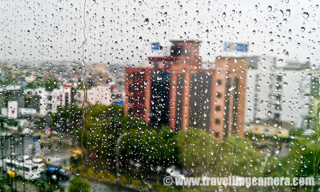 Monsoons are still in on in Northern part of India and it has been more aggressive since last week of august. We are enjoying the aromatic showers of Monsoons and weather is getting better every day. This Photo Journey is sharing some of the monsoon photographs from last 5 years, which are shot in various parts of the country. Let's check out and know more about Monsoons...Clouds are one of my favorite subjects to shoot and this is one of the reasons that I like Monsoons... During Monsoon seasons, just go to hills and enjoy the cloud play which is hard to see in plain areas. Hills in foreground make various shaped clouds look better. I call above photograph as cloud store and this one is not shot from airplane...Monsoons are also best time to find different hues in the sky and of-course these hues vary from one place to other... Above photograph was shot in Spiti, although it's not recommended to visit Spiti in Monsoons. During Monsoons, Spiti valley gets lot of land-slides and at times, roads get closed which can hamper the travel plans in big wayThis year, monsoon started late and there was hardly any aggression in showers... at times, the showers didn't seem like Monsoon rain. But for last three weeks, it's raining like anything. At least National Capital Region of India is getting heavy rains for last few weeks. It's September month now and rains are in full mood. But due to these heavy rains, today we witnessed most clear sky in Delhi, Noida & Gurgaon regions. This is rare to see such clear sky around cities like Delhi. Above photograph is shot in Kashmir during month of June, which was beginning month for Monsoons.Here is another photograph from Monsoon season 2008, when we were on a trek to Shrikhand Mahadev. Monsoon clouds were dramatic around Shrikhand Hills in Himalayan Ranges.In north India, Dharamshala is the place which gets most of the rains. Above photograph is shot near Dharmshala, while we were moving towards a place called Palampur. This is compartively dull version of this photograph. This on is one my favorites and has been published in many of the magazines & newspapers...Monsoons make every river rich with water and at times, things go worse. Specifically, example of Yamuna in Delhi comes to my mind. Yamuna remains dry throughout the year and most of the times thick black water can be seen in this polluted river. But during monsoons, water level goes very high and some part of Delhi gets disturbed... Last year Monsoons in Delhi made many families move out of the shoreline and install tents on roadside for many days.Monsoon really come with various photography opportunities. Next few photographs are shot on car window with mobile camera.There was time, when I experimented a lot with these rain droplets... I will try to find those photographs from archives and will share... It's interesting to shoot different sized droplets on different types of glass, against colorful background created out of numerous subjects... In recent times, rain photographs with colorful lights in background are quite in fashion... Here is another good example of Monsoon Photographs. This photograph is shot around Nainital in Utrakhand. It has high probability to get these kind of rays during monsoons. Although these are easy to find in Hills. Basically, these rays are mainly seen in clear environment which is possible to find in hills and monsoons make it easy for plain areas. Shining rain-drops in a park... It was intentional to defocus everything to get nice bokeh of rain-drops sitting on grass.. A brilliant view of Monsoon Clouds around Narkanda Hills in Shimla, which is one of the favorite place of Bollywood folks... This photograph is shot from Dhomri ground, which is popularly known as Skiing ground in Narkanda town...Another view of same set of clouds from  Narkanda Market..A photograph of one of the office-friends enjoying rains by standing inside AC room with all glass windows closed... Everyone has own ways of enjoying monsoons...Here is another photograph shot at office.. Rain-drops on my office-window @ Noida, IndiThese photographs were shot during 2012 Monsoons. It was a three days long monsoon rain that made a park look like lake. There are around 4 feet high water in the park.. It's a park in Noida - Sector26.Few more Photographs from same park.A photograph shot around Chamba hills in Himalayan State of India - Himachal Pradesh.This one was very threatening... A scene from Dalhousie, Himachal Pradesh, INDIA