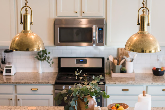 Sherwin Williams Austere Gray Kitchen Cabinets with Brass Pendants