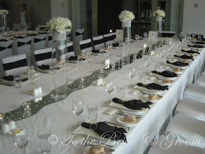 Our gorgeous designer chair covers in white with the black band diamante 