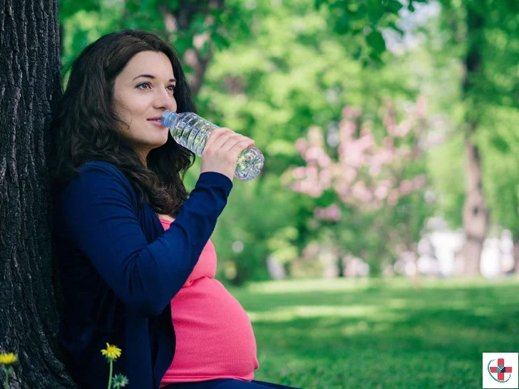 Pregnant woman drinking water