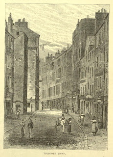 A drawing of how Tolbooth Wynd looked prior to the 1880s - it shows a street with tall tenement blocks on either side.  the street is cobbled and there are various people walking up and down it.