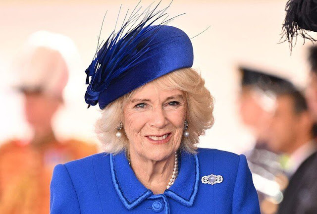 Catherine wore a bespoke Emilia Wickstead coatdress. Diana Collingwood pearl earrings. Prince of Wales feather brooch