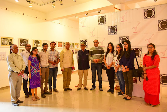 Group shot with photograph competition participant winners and co jury members.