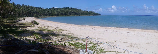 view of the white sand beach to the left of Bacayaw Resorts Cove in Llorente Eastern Samar, which is about 300 meters from the highway (9HFW+9QV)