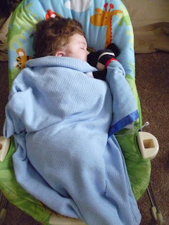 baby mason sleeping in bouncer