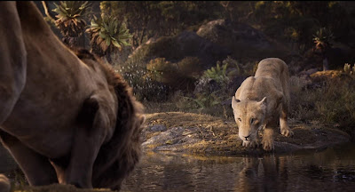 The Lion King 2019 movie still where Beyonce's Nala and Donald Glover's Simba drink water out of a lake and sing Can You Feel the Love Tonight together