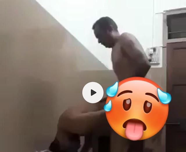 Indian Old Man With A Man In A Room