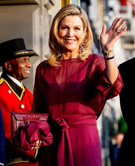 Queen Maxima wore a new burgundy Odirc silk muslin top, and Oscar pareo trousers by Natan Couture. Natan Couture SS24 collection