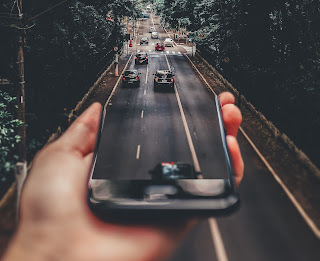 Cars driving from cell phone to road