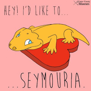 Prehistoric lizard on a box of chocolates, captioned 'Hey! I'd like to  ... Semouria'