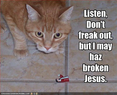 funny-pictures-cat-worries-he-has-broken-jesus.jpg