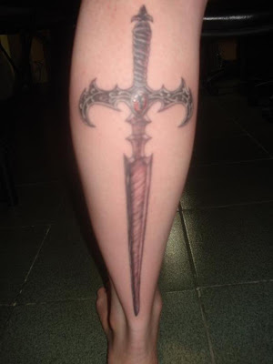 Long sword on calf tattoo