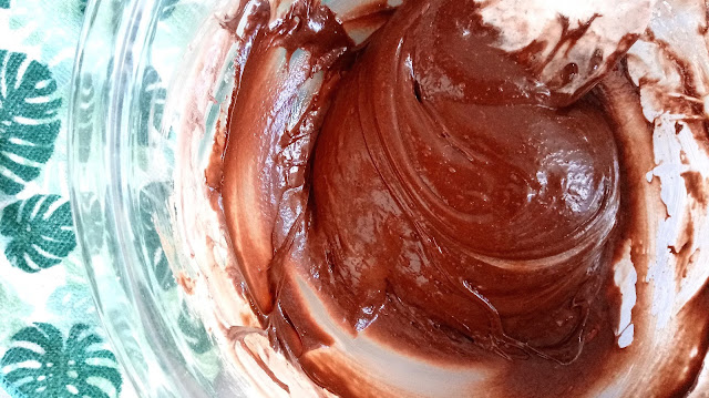 a mixing bowl full of chocolate fondant mixture