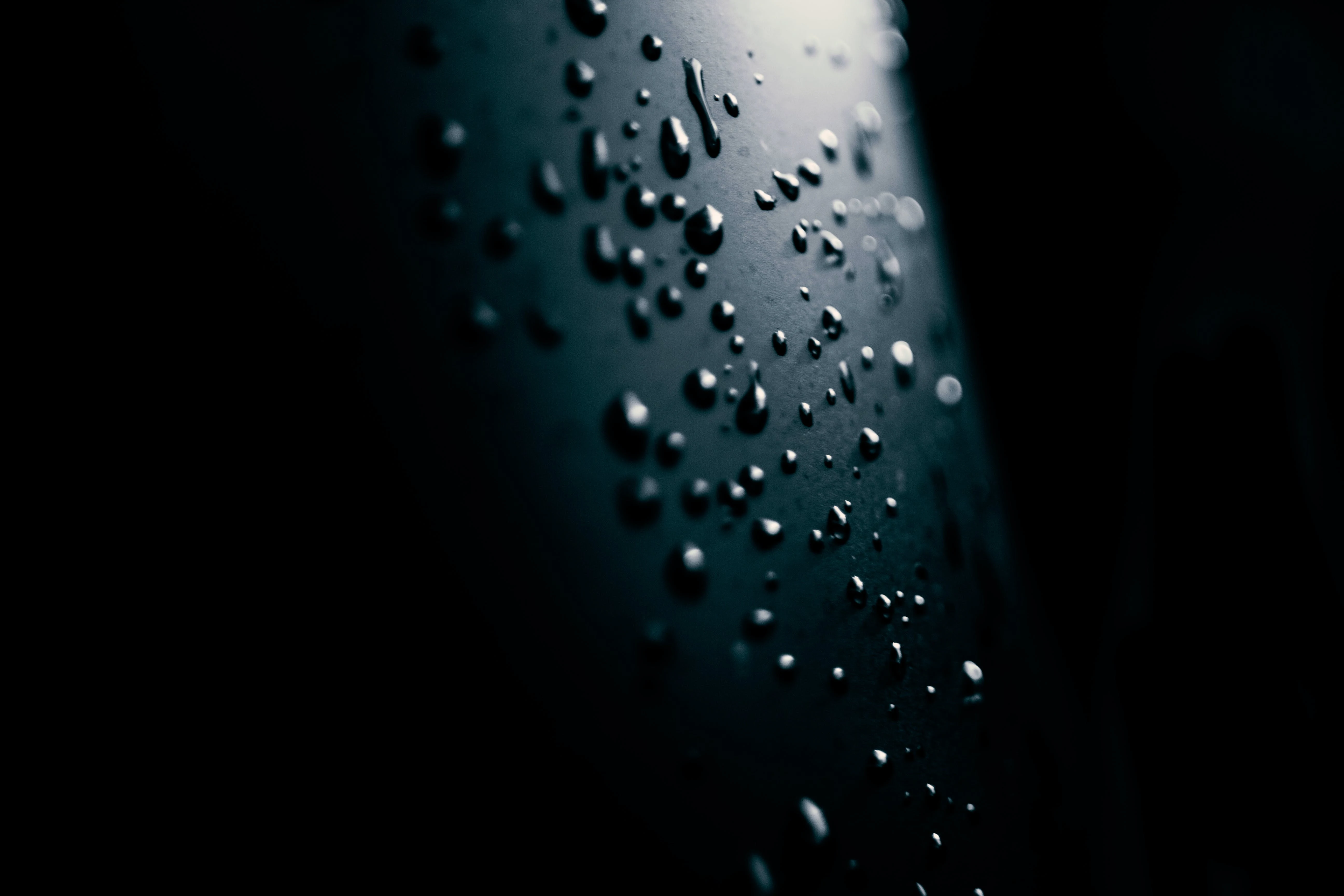 Water drop light black background
