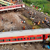 As services restart, a train crosses the side of the Indian rail catastrophe.