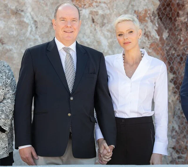 Princess Charlene wore a white stand collar poplin blouse by Akris. La Societe Protectrice des Animaux (SPA) of Monaco. Prince Albert