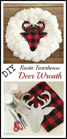 Vintage, Paint and more...a DIY Farmhouse Christmas Wreath done by tying yarn pom poms on a wire wreath form and then adding a wood deer head silhouette decoupaged with red and black buffalo plaid flannel.  The perfect rustic  wreath to add to your farmhouse decor this season.