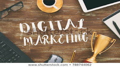 Digital marketing graphics over a brown work table with work tools, eye glasses, calculator, a mug of beverage, white notepad, gold cup trophy, pencil and pen.