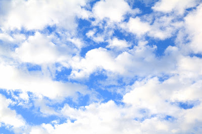 Blue Sky with Fluffy White Clouds - Photo by Mademoiselle Mermaid