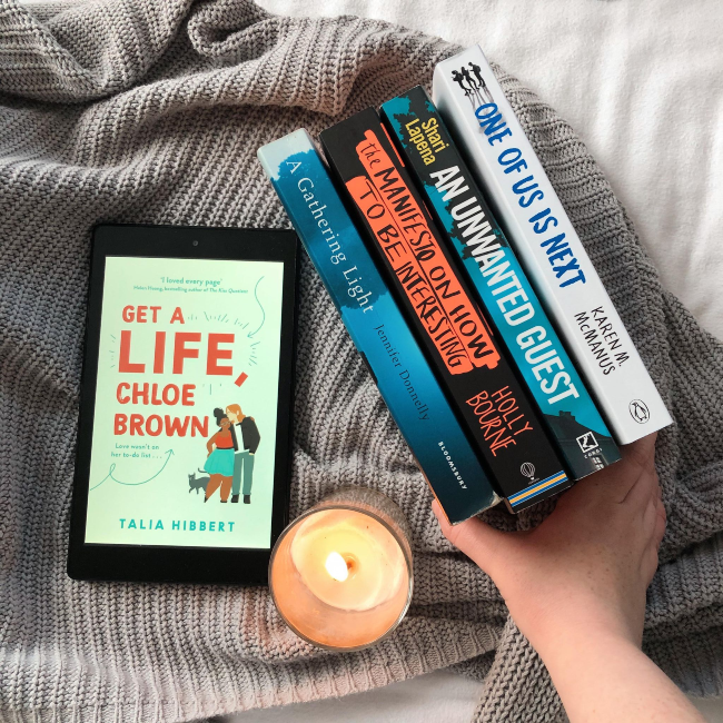 Four books stacked spines facing up next to the kindle cover for Get a Life Chloe Brown