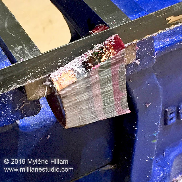 Using a Japanese saw to cut the resin cup into thin slices