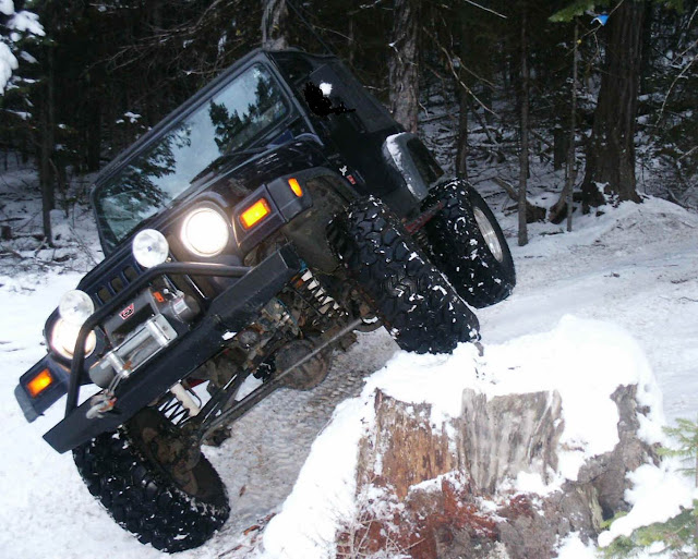 Black Jeep Wrangler Jumping