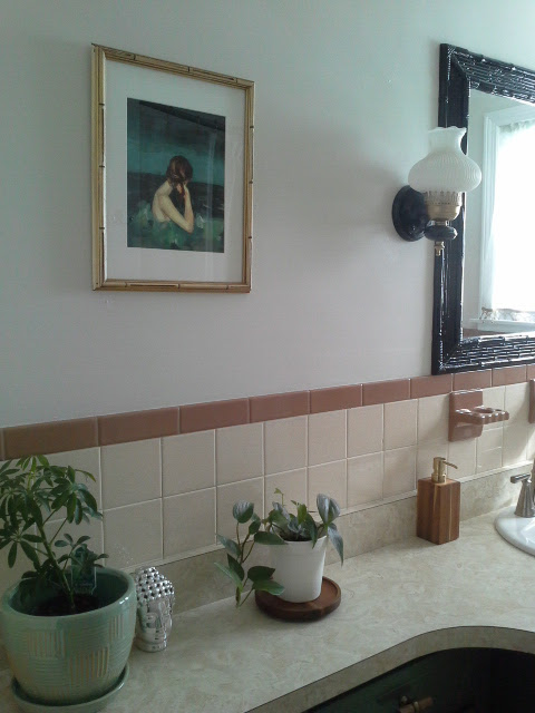 Vintage Bathroom Makeover gold black light fixture bamboo mirror painting plants