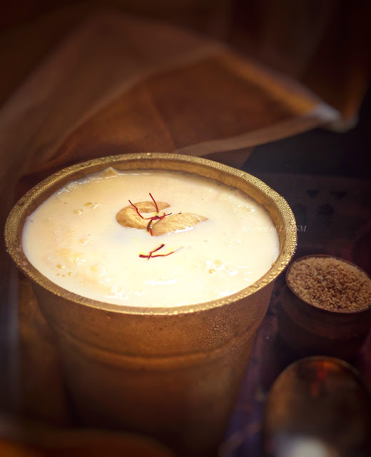 "A glass of Gase Gase Payasam garnished with roasted cashew nuts and saffron - A heavenly dessert from Karnataka, India."