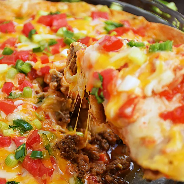 Taco Pie slice being lifted out of pie plate