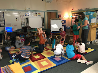 whole class listening on the rug