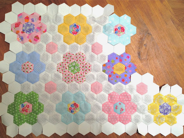 Hexagon quilt made from pink, green and aqua Lakehouse Dry Goods fabric