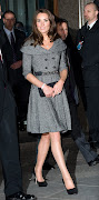 Flying Solo. On Feb. 8, 2012, the Duchess wore a belted gray dress and black .