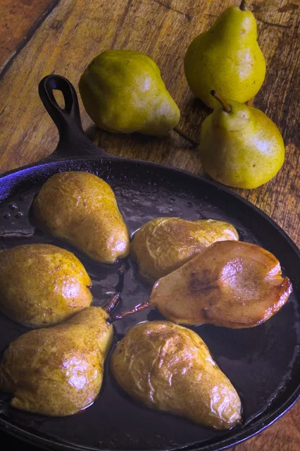 Roasted Cinnamon Buttery Pears, simple dish showcasing the straightforward flavor of pears.  They are buttery slightly sweet served as an accompaniment to pork, garnished in a winter salad, but also makes an elegant dessert for a fall dinner party, bridal brunch and quick weeknight snack.