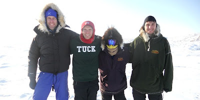 Four team members of Polar Vision dressed in ski parkas