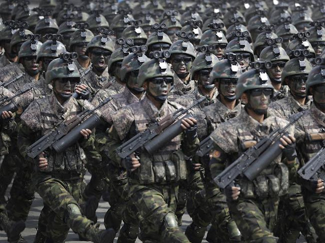 Commandoes march across the Kim Il Sung Square during a military parade in Pyongyang. 