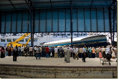 Repair crews from Egyptian Railways lifting derailed train cars